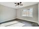 Well-lit bedroom featuring hardwood floors and a window at 6514 Highwood Pl, Charlotte, NC 28210