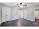 Bedroom with dark hardwood floors and double doors at 6514 Highwood Pl, Charlotte, NC 28210