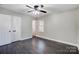 Spacious bedroom with hardwood floors and window at 6514 Highwood Pl, Charlotte, NC 28210