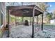 Outdoor gazebo with stone fireplace and metal detailing at 6514 Highwood Pl, Charlotte, NC 28210