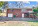 Brick house with attached garage, gazebo, and basketball goal at 6514 Highwood Pl, Charlotte, NC 28210