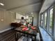 Open kitchen flowing into dining area with large window, perfect for entertaining at 6514 Highwood Pl, Charlotte, NC 28210