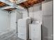Basement laundry room with washer, dryer, and extra storage at 6514 Highwood Pl, Charlotte, NC 28210