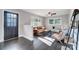 Living room with modern furniture and a half wall at 6514 Highwood Pl, Charlotte, NC 28210