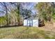Blue and white storage shed in grassy backyard at 6514 Highwood Pl, Charlotte, NC 28210