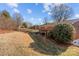 Sloped backyard with some landscaping at 700 Snuggs St, Albemarle, NC 28001