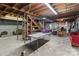 Unfinished basement with various storage items at 700 Snuggs St, Albemarle, NC 28001