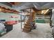 Unfinished basement area with wooden stairs at 700 Snuggs St, Albemarle, NC 28001