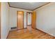 Spacious bedroom with hardwood floors and ample closet space at 700 Snuggs St, Albemarle, NC 28001
