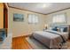 Virtually staged bedroom with hardwood floors and updated decor at 700 Snuggs St, Albemarle, NC 28001