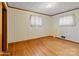 Virtually staged bedroom with hardwood floors and neutral decor at 700 Snuggs St, Albemarle, NC 28001