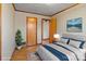 Virtually staged bedroom featuring a comfortable bed and hardwood floors at 700 Snuggs St, Albemarle, NC 28001