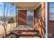 Front entrance with brick steps and metal railing at 700 Snuggs St, Albemarle, NC 28001