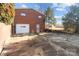 Detached brick garage with a large driveway at 700 Snuggs St, Albemarle, NC 28001