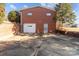 Detached brick garage with a large driveway at 700 Snuggs St, Albemarle, NC 28001