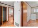 Home hallway with access to bedroom and laundry at 700 Snuggs St, Albemarle, NC 28001