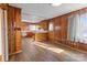 Bright kitchen with wood cabinets and laminate flooring at 700 Snuggs St, Albemarle, NC 28001