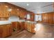 Kitchen with wood cabinets and laminate floor at 700 Snuggs St, Albemarle, NC 28001