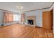 Living room with hardwood floors and fireplace at 700 Snuggs St, Albemarle, NC 28001