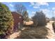 Side yard with a large tree and driveway at 700 Snuggs St, Albemarle, NC 28001