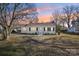 White house with a brown roof, landscaping, and a driveway at 721 York S Ave, Rock Hill, SC 29730