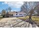 Front view of a charming white house with a carport at 721 York S Ave, Rock Hill, SC 29730