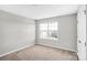 Well-lit bedroom with large window and carpet at 7251 Waterwheel Sw St, Concord, NC 28025