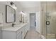 Modern bathroom with double vanity and walk-in shower at 741 Mcalway Rd, Charlotte, NC 28211