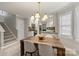 Dining area with wood table and chairs, and view into the kitchen at 741 Mcalway Rd, Charlotte, NC 28211