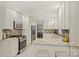 Modern kitchen with white cabinets, granite countertops, and stainless steel appliances at 741 Mcalway Rd, Charlotte, NC 28211