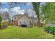 Spacious backyard showcasing a raised deck, lush greenery, and partial privacy fence at 741 Mcalway Rd, Charlotte, NC 28211