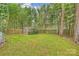 Secluded backyard featuring a lush lawn, mature trees, wooden shed and privacy fence at 741 Mcalway Rd, Charlotte, NC 28211