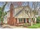 Charming home featuring a classic brick facade, inviting front porch, and well-maintained landscaping at 741 Mcalway Rd, Charlotte, NC 28211