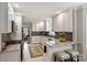 Well-lit kitchen featuring white cabinetry, granite countertops, and stainless steel appliances at 741 Mcalway Rd, Charlotte, NC 28211