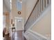 Bright and spacious entryway with hardwood floors, elegant staircase, and natural light at 79151 Ridgehaven Rd, Lancaster, SC 29720