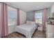 Bedroom with a full bed and pink curtains at 8300 Waxhaw Hwy Hwy # 103, Waxhaw, NC 28173