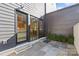 Private patio with flagstone flooring and French doors leading to the interior at 9025 Tynecastle Commons Ct # 2, Charlotte, NC 28226