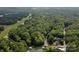 Aerial view of waterfront property with lush trees and homes at 1090 N Saunders Dr, Catawba, NC 28609