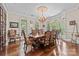 Elegant dining room featuring hardwood floors and a large table with seating for eight at 1090 N Saunders Dr, Catawba, NC 28609