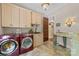 Convenient laundry room with ample cabinet space, washer, and dryer at 1090 N Saunders Dr, Catawba, NC 28609