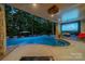 Inviting outdoor pool with a covered patio and large screen at 1090 N Saunders Dr, Catawba, NC 28609