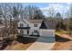 Aerial view of a two-story house with a two-car garage and a long driveway at 116 Desert Sky Ct, Statesville, NC 28625