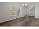 Bright dining room with hardwood floors and large window at 116 Desert Sky Ct, Statesville, NC 28625