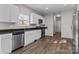 Modern kitchen with stainless steel appliances and white cabinets at 116 Desert Sky Ct, Statesville, NC 28625