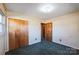 Bedroom with double doors and green carpet at 1219 Burke Rd, Shelby, NC 28152