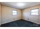 Simple bedroom with carpet and two windows at 1219 Burke Rd, Shelby, NC 28152