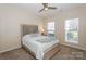 Bedroom with neutral decor, carpeted floor, and ceiling fan at 139 Welcombe St, Mooresville, NC 28115