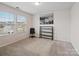 Bright bedroom with two windows, carpeted floor, and shelving unit at 1414 Kings Grove Dr, York, SC 29745