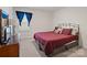 Bedroom with a king-size bed, dresser, and window with curtains at 1414 Kings Grove Dr, York, SC 29745