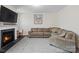 Gathering room with gas fireplace and comfortable sectional sofa at 1414 Kings Grove Dr, York, SC 29745